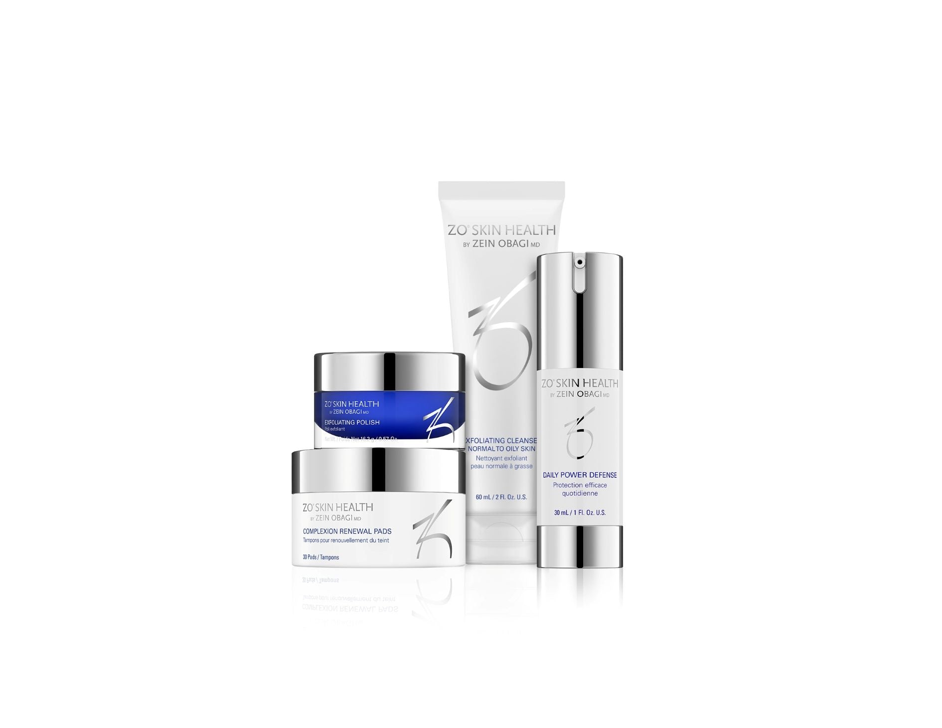 A collection of skincare products including an exfoliating cleanser, exfoliating polish, complexion renewal pads, and daily power defense serum, all labeled as travel size.